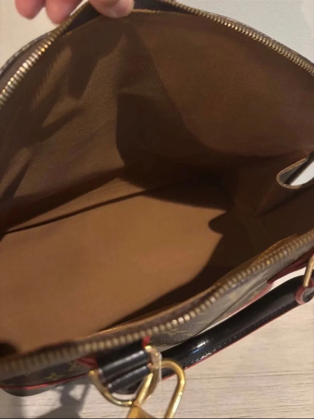 Louis Vuitton Monogram Alma Satchel in Brown with Red Trim
